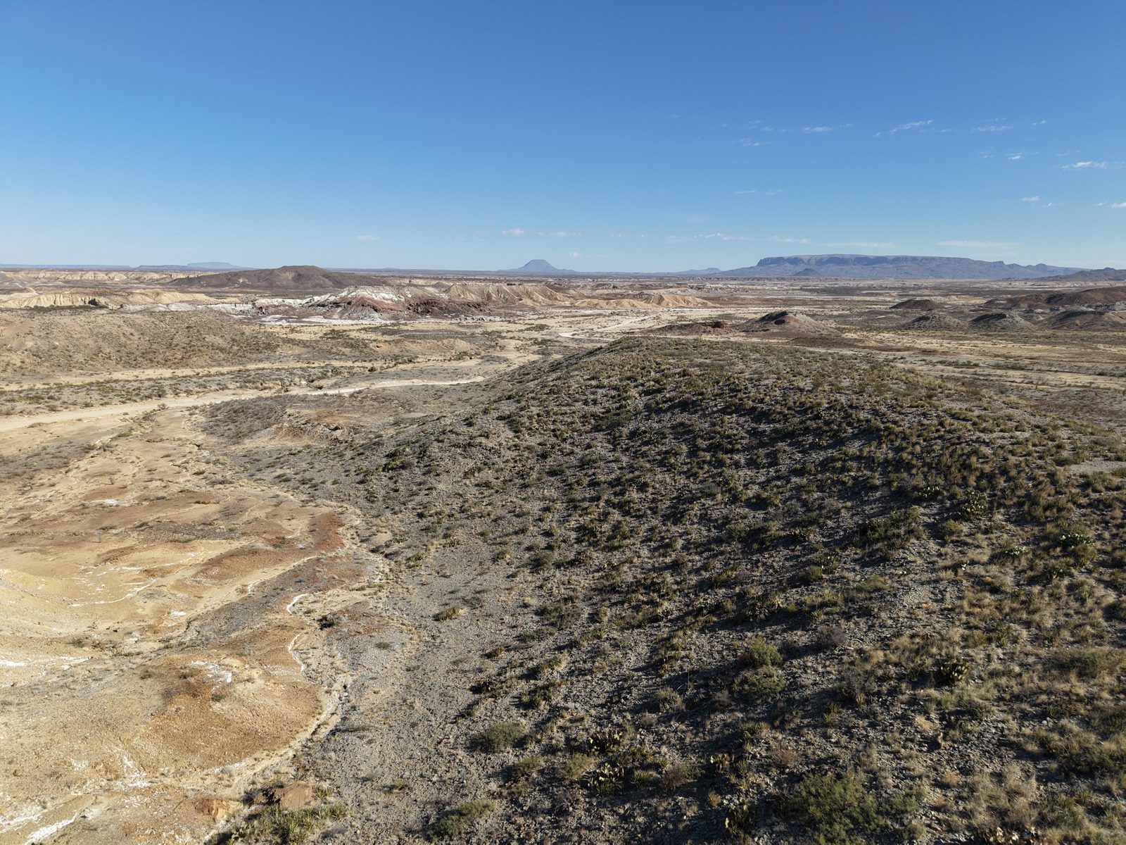 Aerial drone photo of West Texas rangeland showing arroyos and natural drainage patterns used for elevation mapping and water harvesting analysis